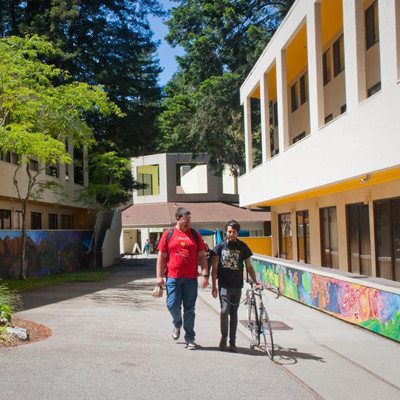 Students walking near Kresge's mural