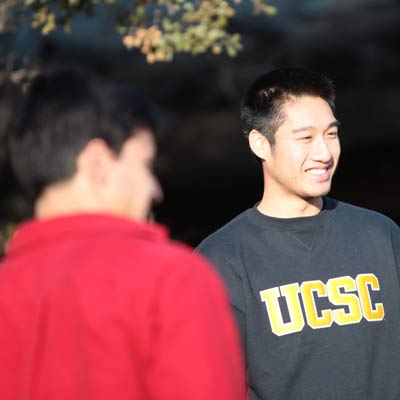 Happy student with black UCSC sweater.