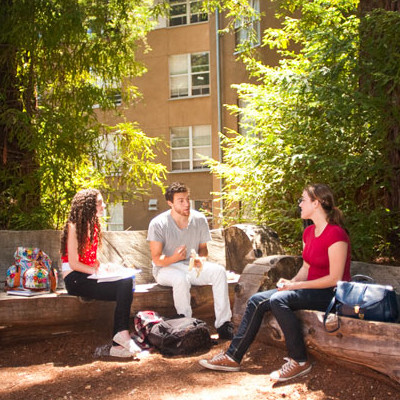 Students talking outside at John R. Lewis College
