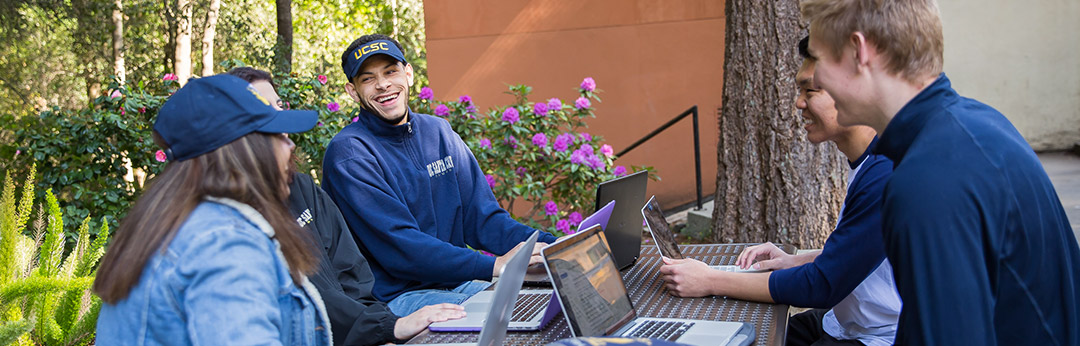 Students studying at a outdoor table at UCSC